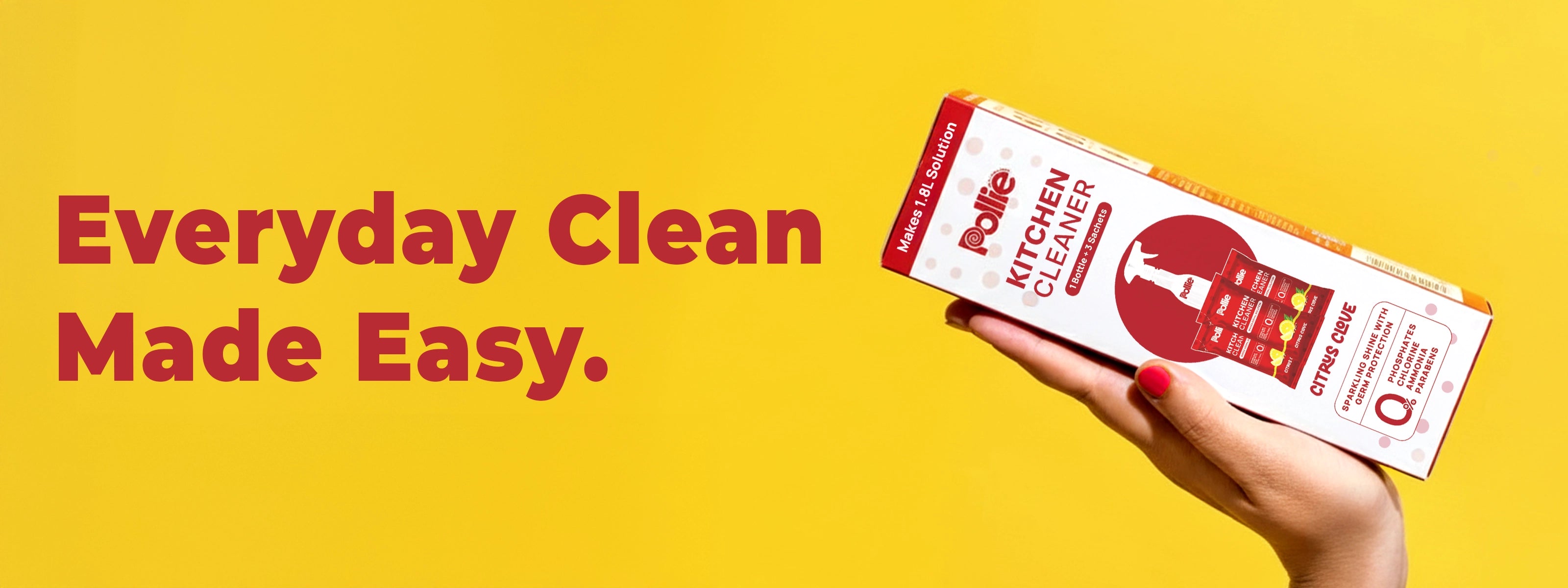 Pollie Kitchen Cleaner pack held in hand against yellow background, citrus clove formula for everyday kitchen cleaning and fresh, germ-protected shine.
